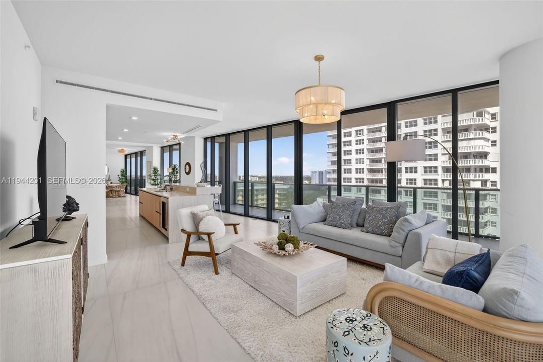 Light filled open living area with floor to ceiling glass and seamless indoor outdoor flow to expansive terrace.