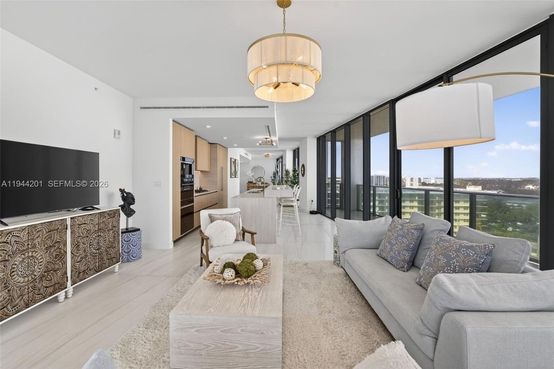 Light filled open living area with floor to ceiling glass and seamless indoor outdoor flow to expansive terrace.