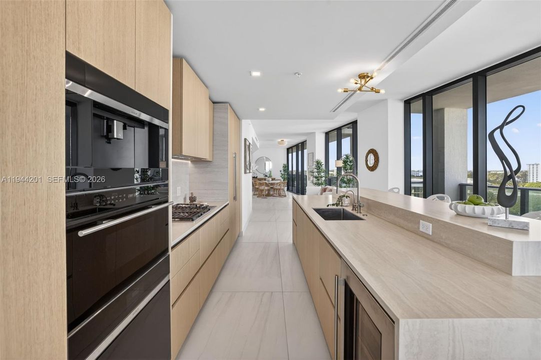 Chef-ready galley kitchen with Sub-Zero and Wolf appliances w/ wine cooler, plus integrated espresso/cappuccino system. Italian cabinetry and stone counters