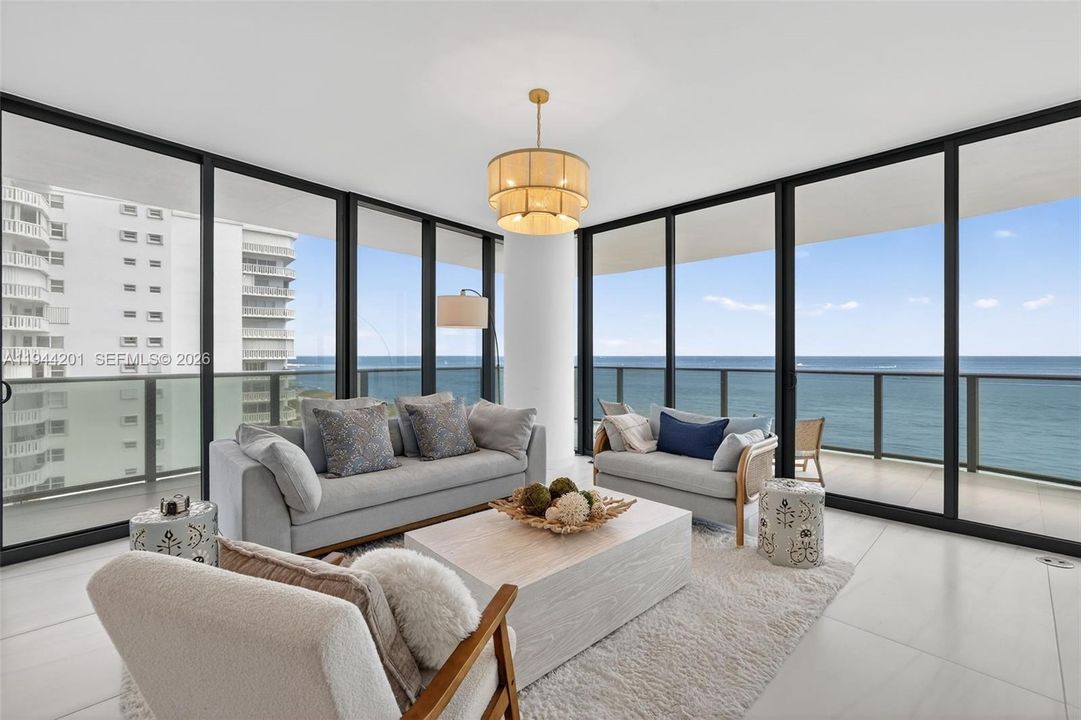 Light filled open living area with floor to ceiling glass and seamless indoor outdoor flow to expansive terrace.