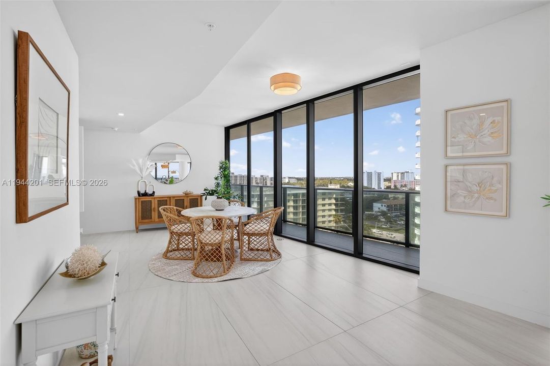 Open dining area with floor to ceiling glass, adjacent to chef’s kitchen and terrace for seamless indoor outdoor entertaining. This area is also a possible den / 4th bedroom as per the builders plans. Unit is a 4 bedroom per tax roll