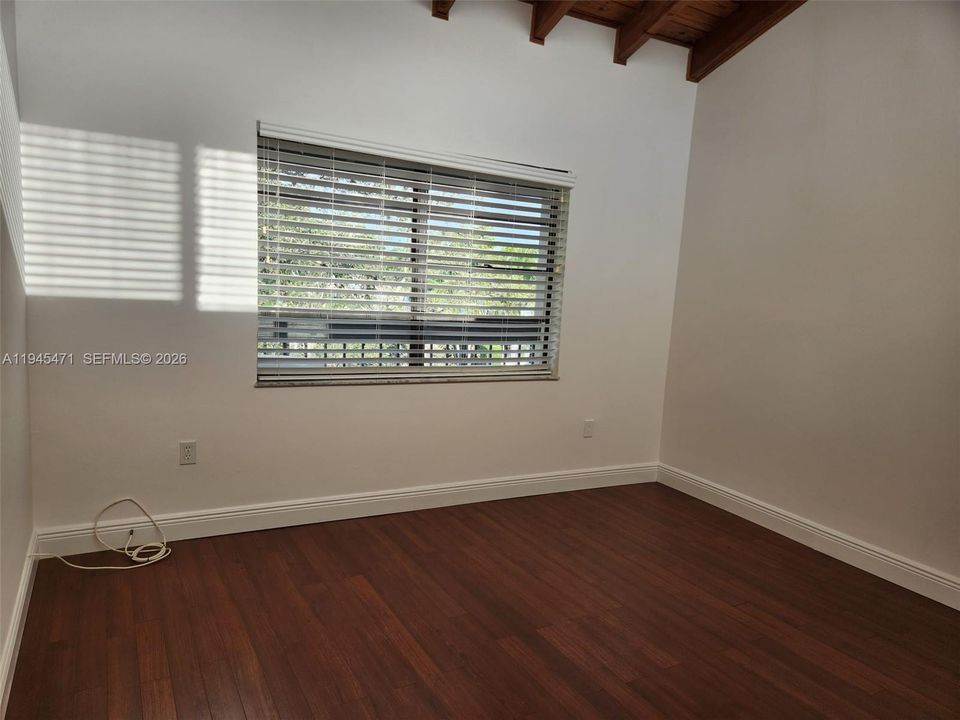 Second bedroom shows view of balcony and canal through the window.