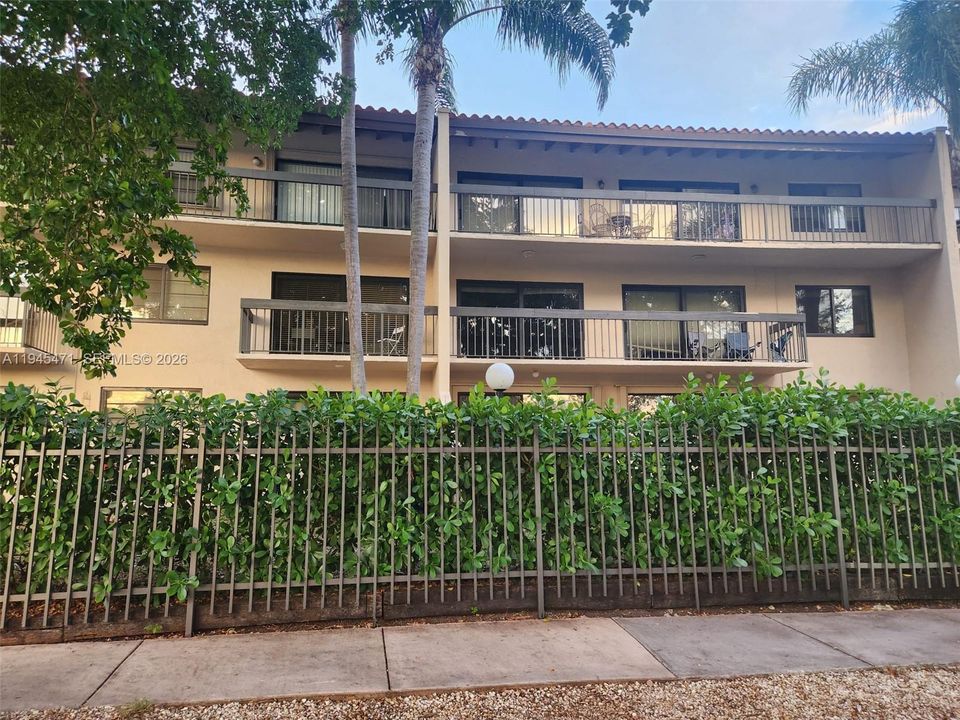 Three story building with 6 units on each floor, fenced and gate property.
