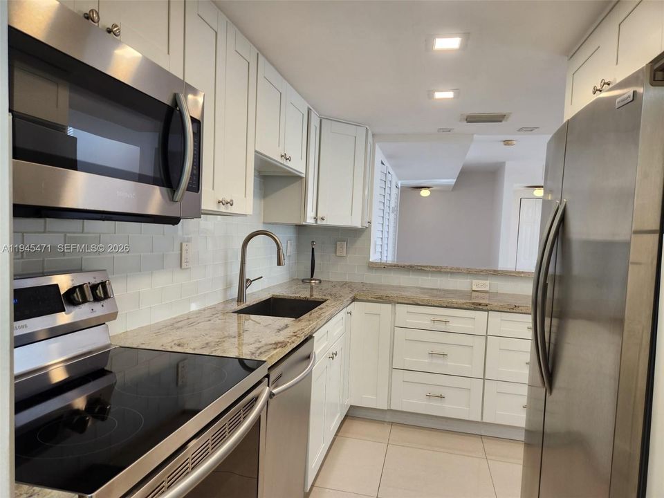Additional view of kitchen.