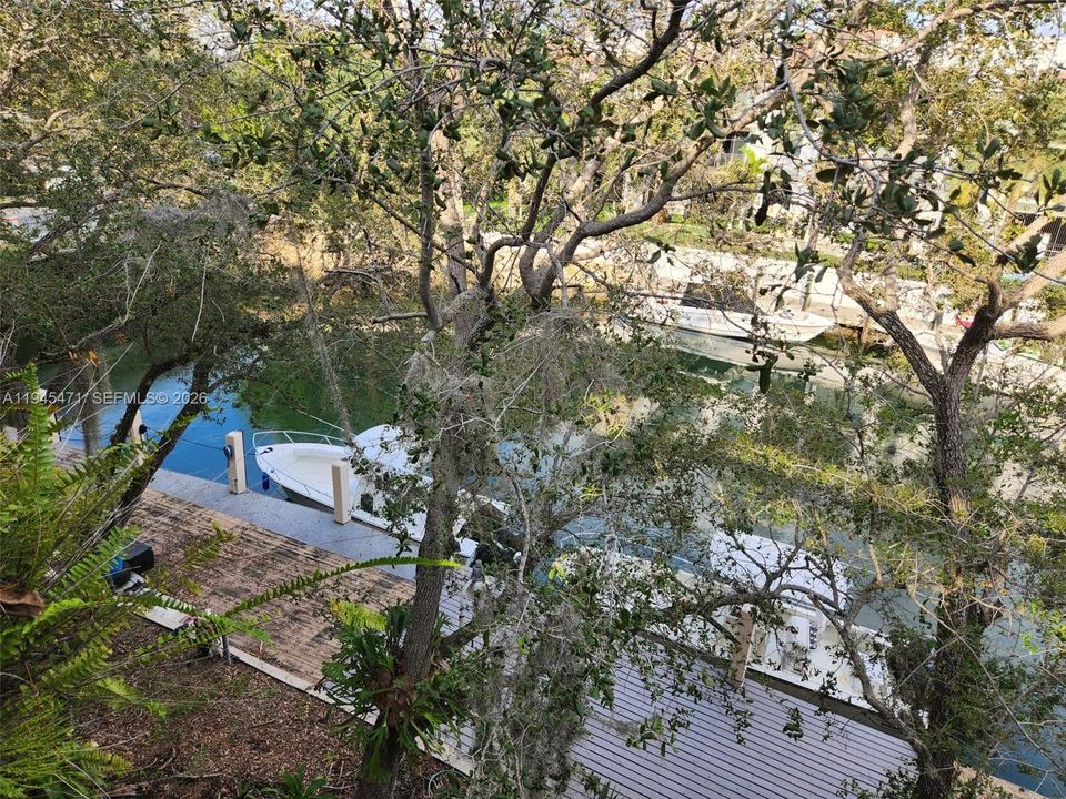 Direct view to canal and dock area from unit balcony.