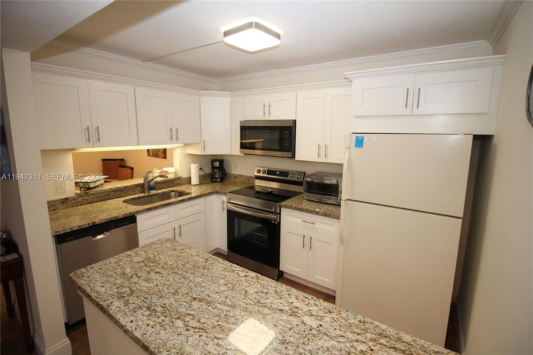 Refrigerator has been replaced with new stainless steel refrigerator.