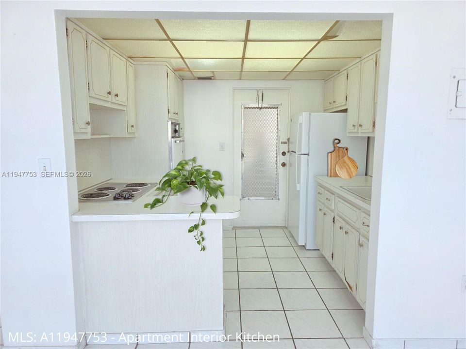 DINNING ROOM LOOKING TOWARDS KITCHEN