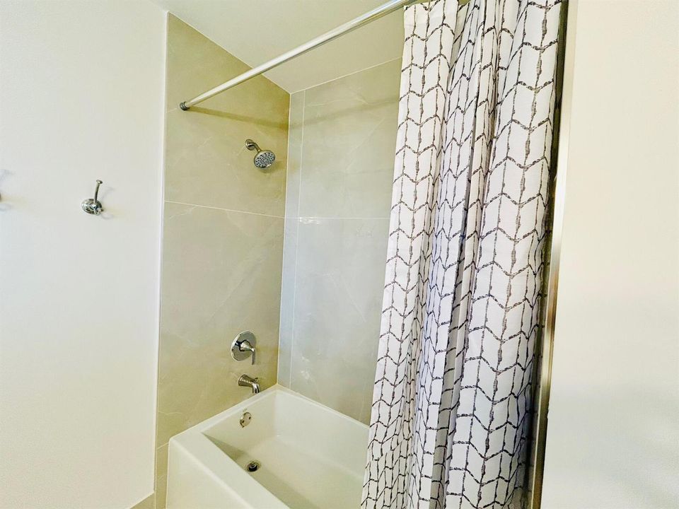 NEW TUB AND TILES WALLS