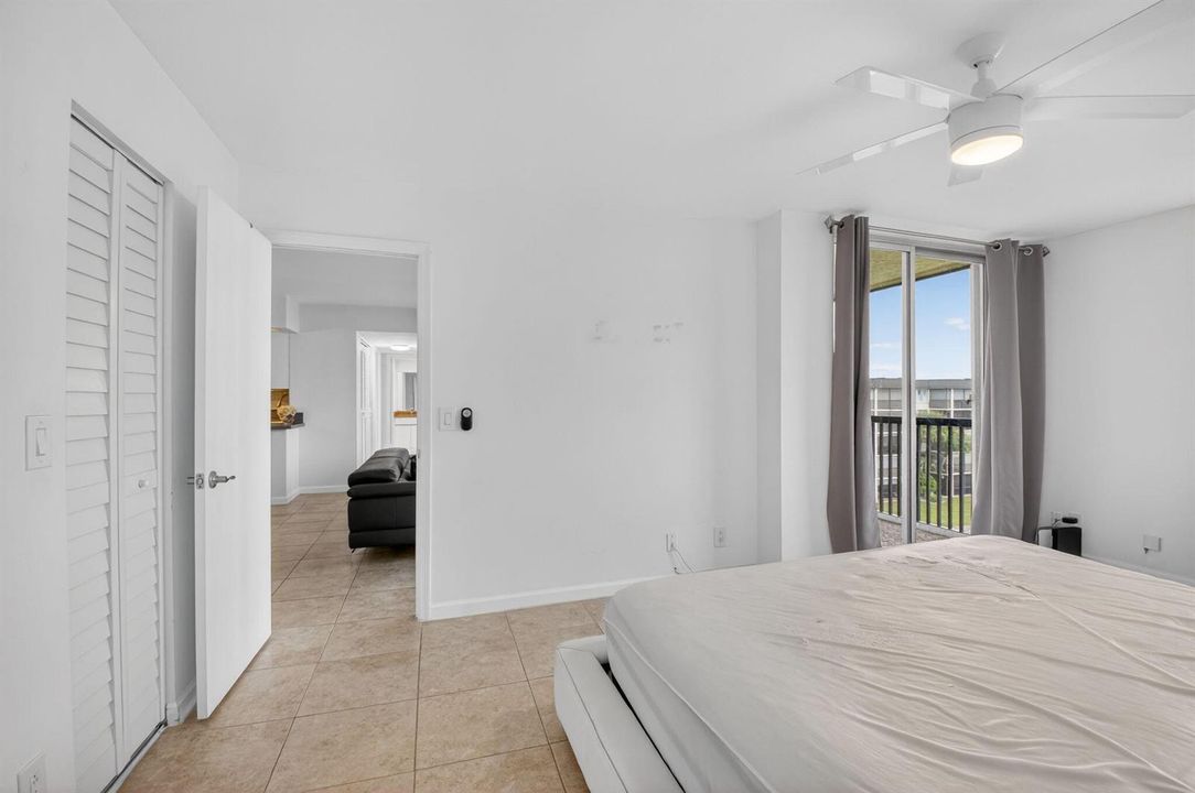 15 Primary Bedroom Entry & Balcony View
