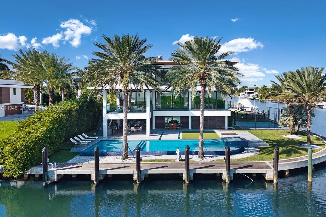 Fabulous corner lot with large infinity edge pool and baja shelf. Water access for paddleboards and kayaks to the left.