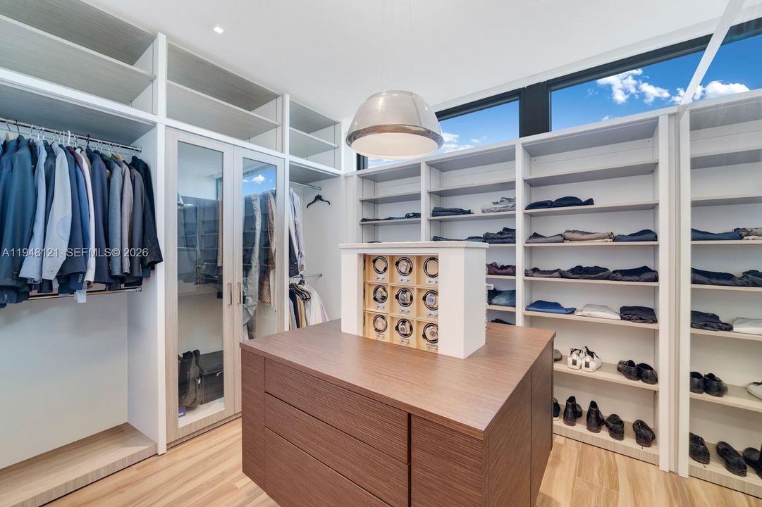 Hidden watch storage with winders by Studio Becker.