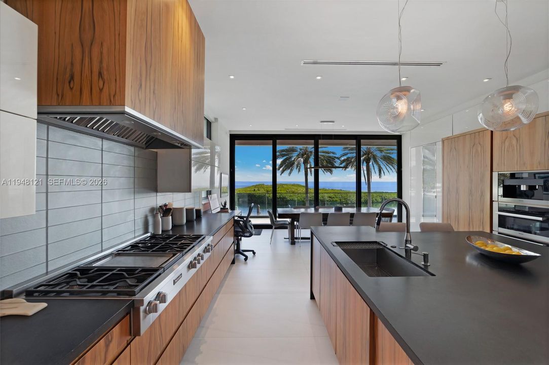 Gas Range, built in coffee maker and huge island for casual family gatherings.