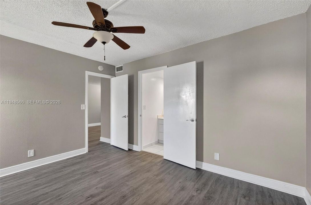 View of Master Bedroom to Living and entrance to Bathroom