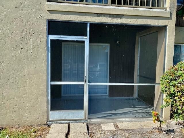 Screened in patio with storage unit