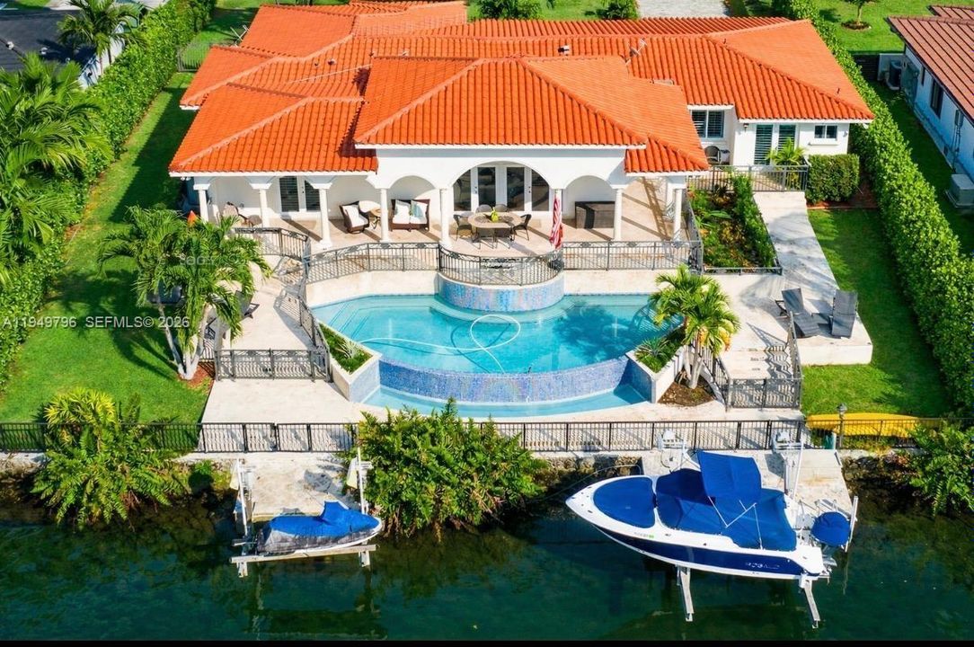Arial Back with waterfront and Infinity pool