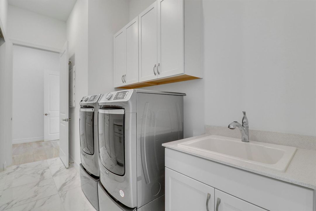 Laundry Room with Extra Storage Cabinets