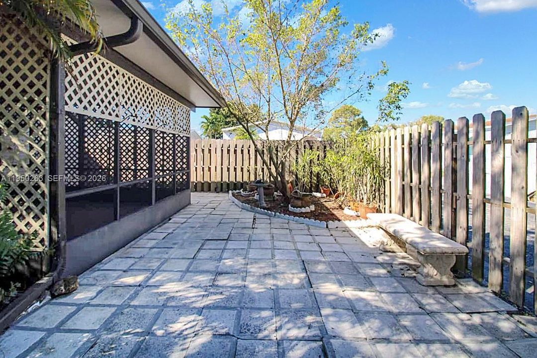 Pavers off patio at side of house