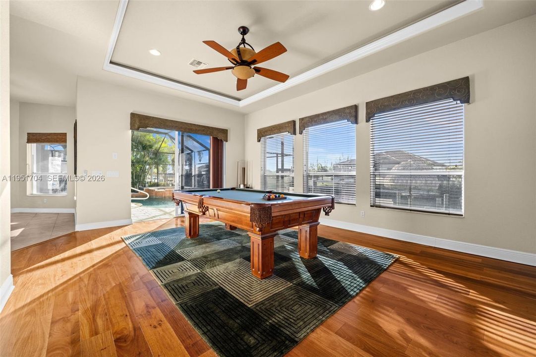 Direct access to the lanai and pool from the game room