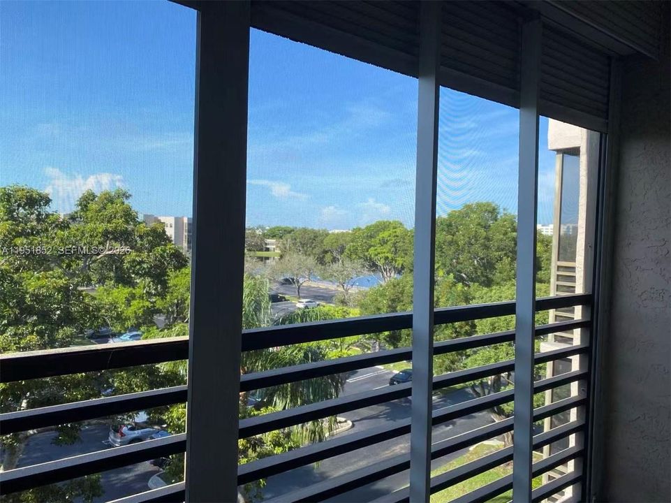 Tree-lined and partial lake view
