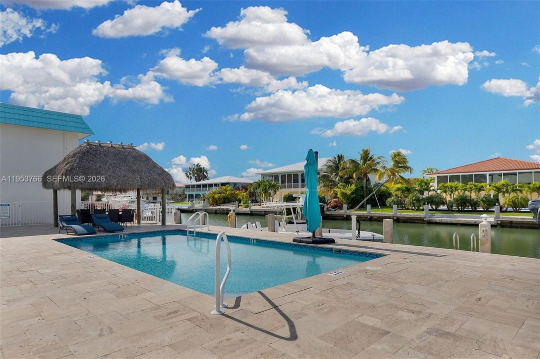 Relax and unwind in the condo’s fun tiki area, complete with a poolside vibe perfect for sipping and socializing.