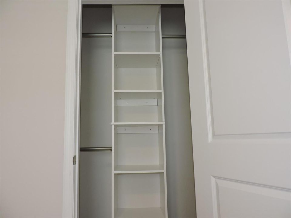 BEDROOM #2 CLOSET WITH BUILTIN STORAGE