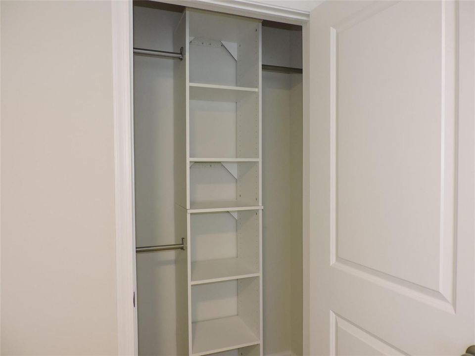 BEDROOM #3 CLOSET WITH BUILTIN STORAGE