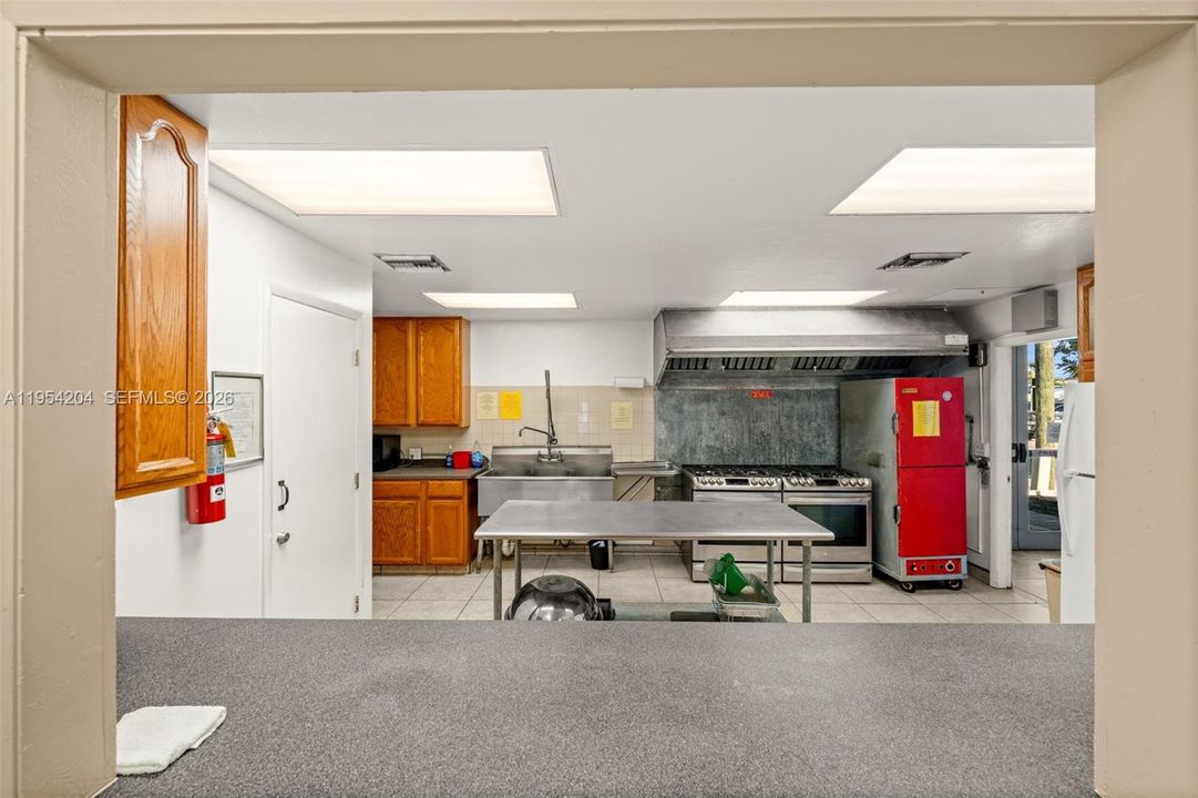 Serving window at well-appointed commercial kitchen