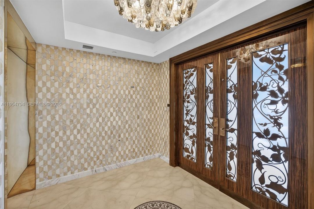 Step off the elevator to your private foyer.