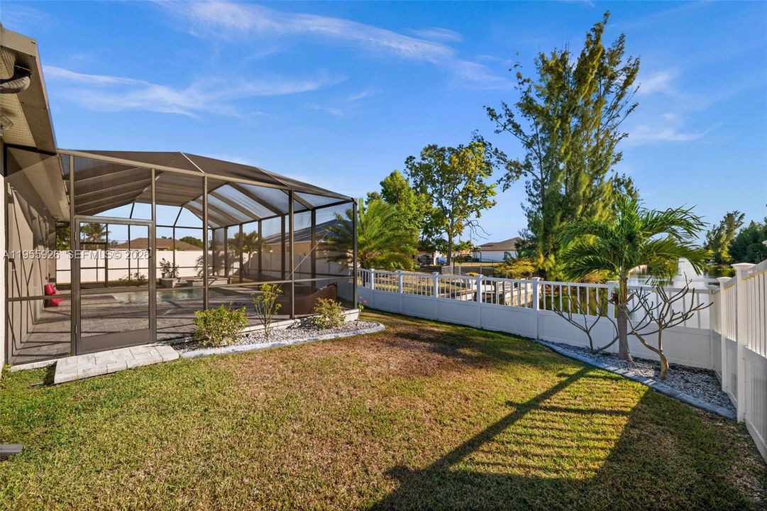 Fenced yard with views of the canal
