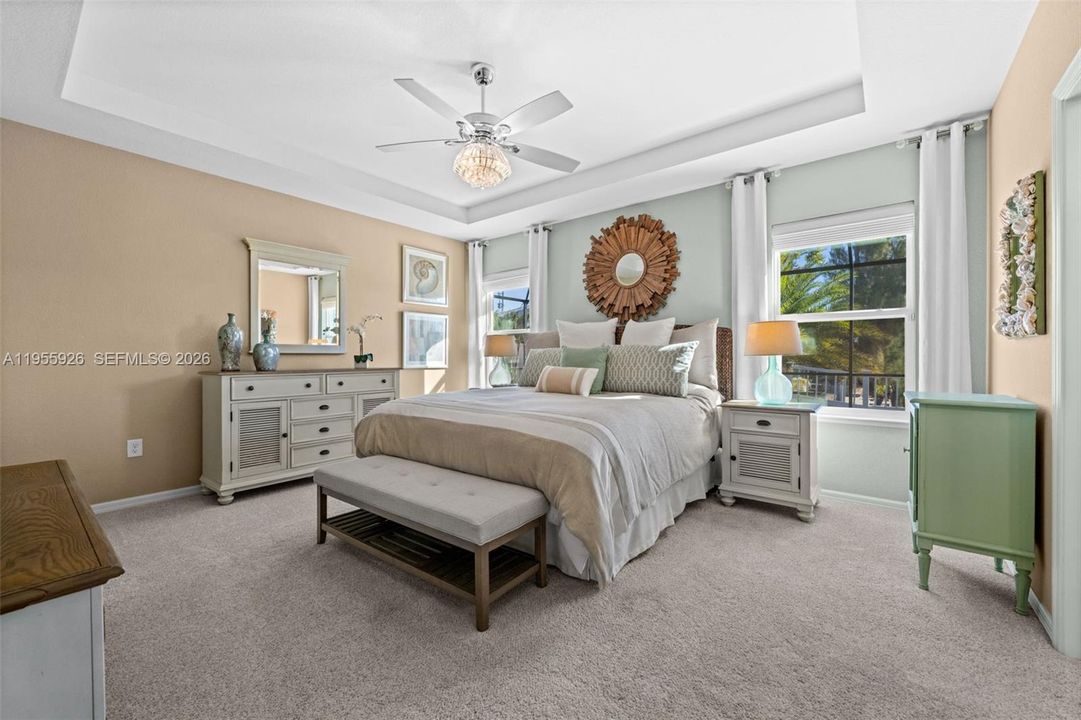 Primary bedroom with tray ceiling