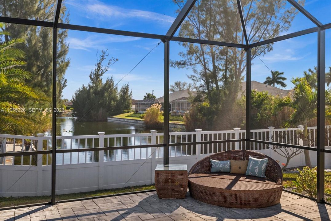 Screened lanai with canal backdrop
