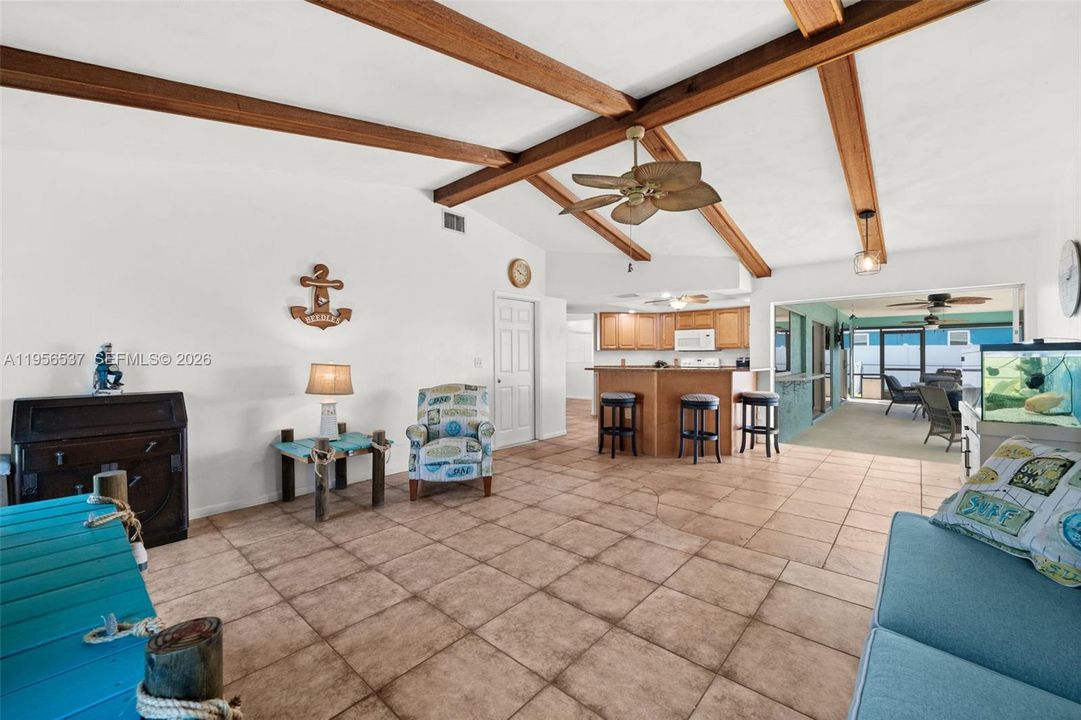 Open Family Room looking toward the Kitchen and Pool