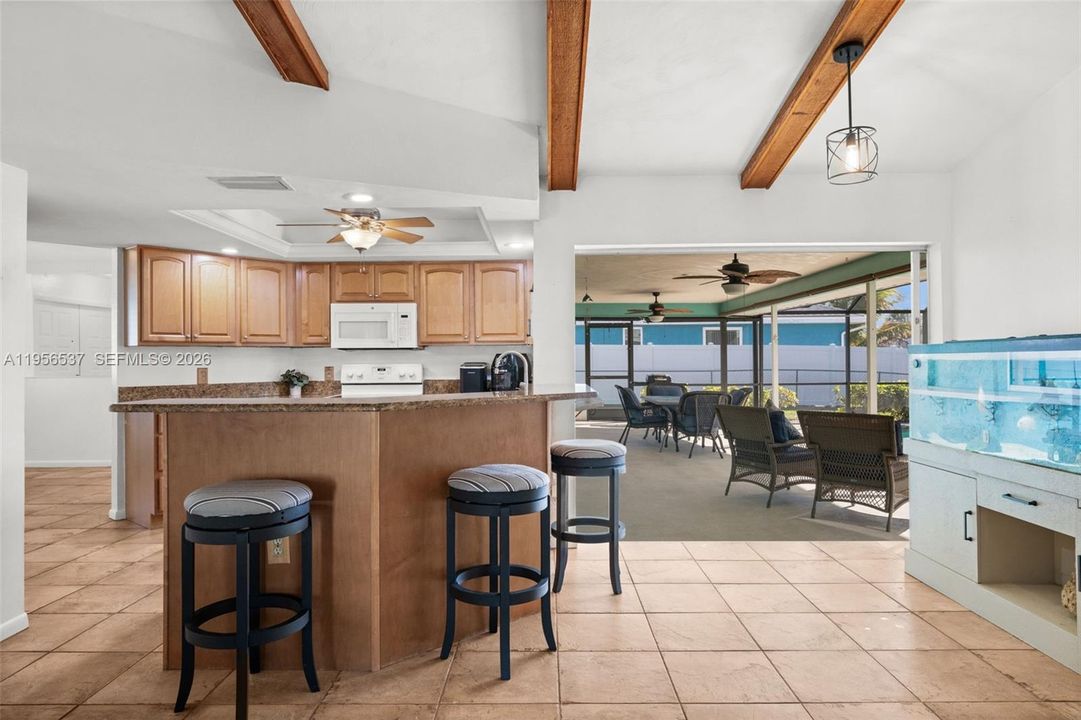 Breakfast bar seating, just steps from the pool