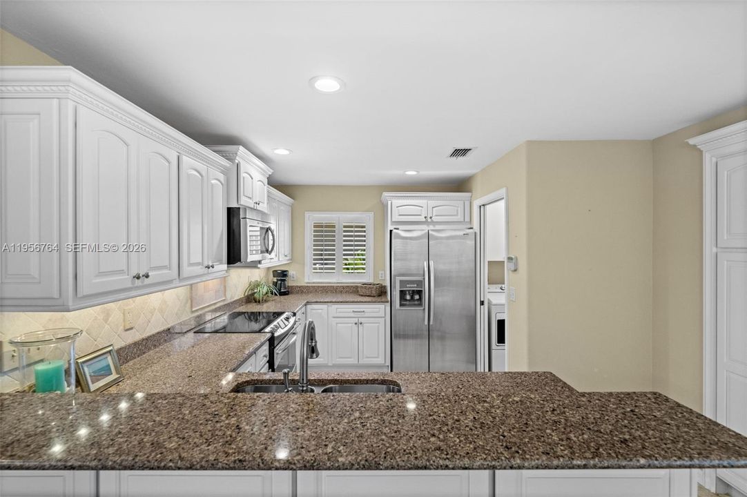 Updated kitchen with white cabinetry