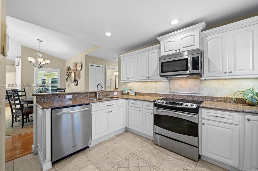 Granite countertops and tile backsplash