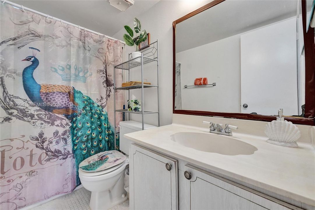 The master bathroom features a spacious design and a relaxing atmosphere