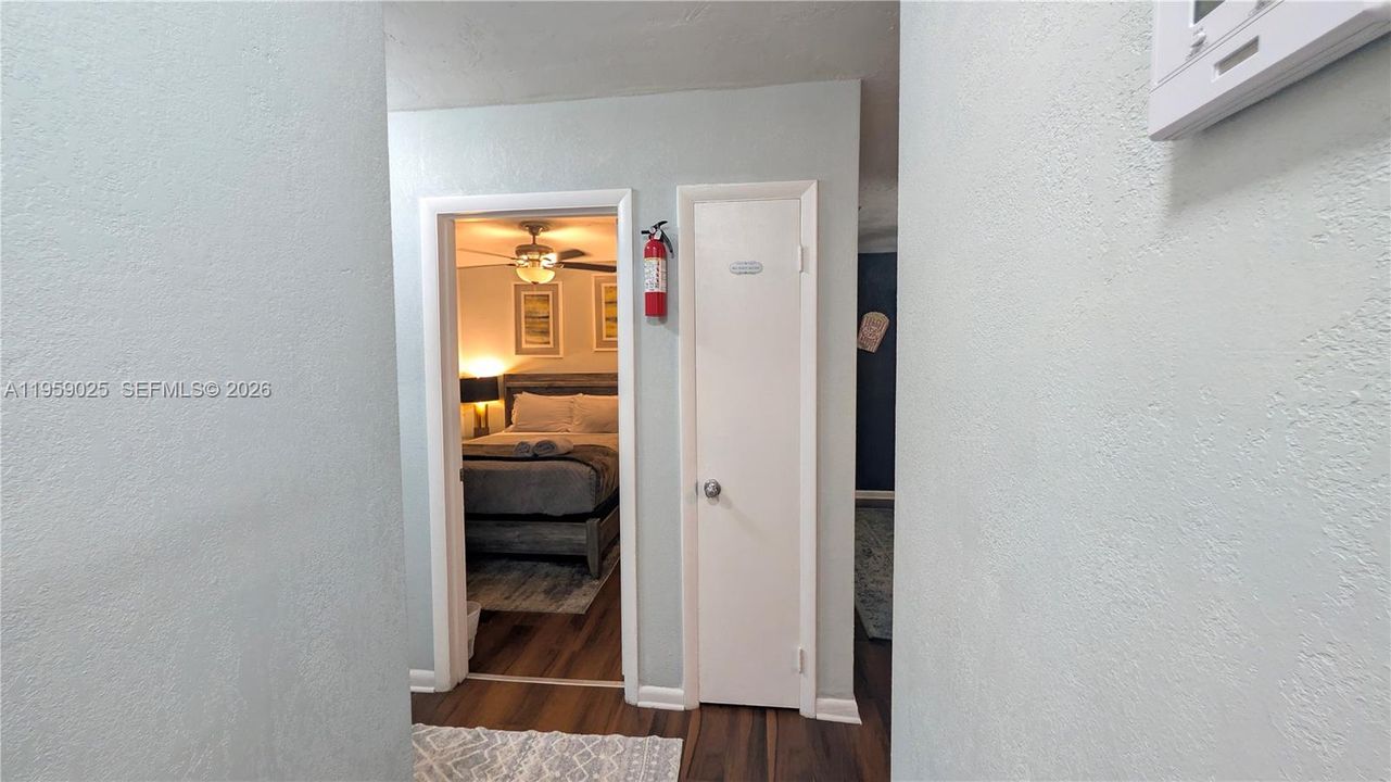 View of bedroom#1 from the living room area. Bedroom1 is located to the right hand side of the entrance hallway.