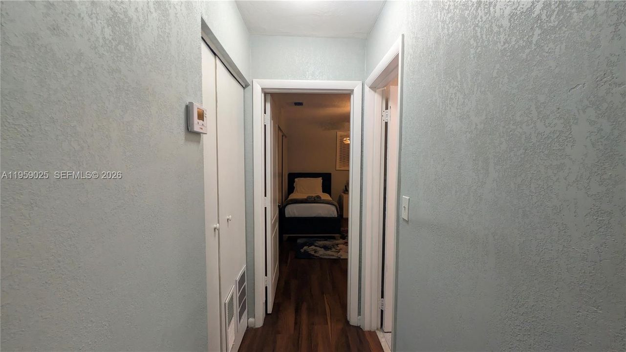 View from hallway into the bedroom 2. Befre then we pass bath room 1