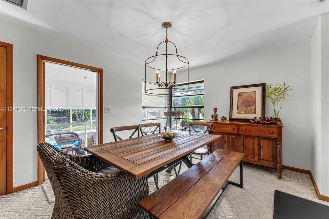 FORMAL DINING W/ RUSTIC MODERN TOUCHES OVERLOOKING THE GROUNDS.