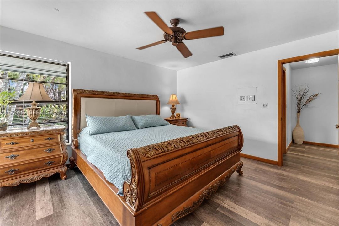PRIMARY BEDROOM W/ NEW MODERN WOOD FLOORS, OPEN & AIRY FEELING