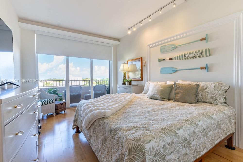 The Bedroom was furnished with a walk-in closet that included wooden drawers and shelves.