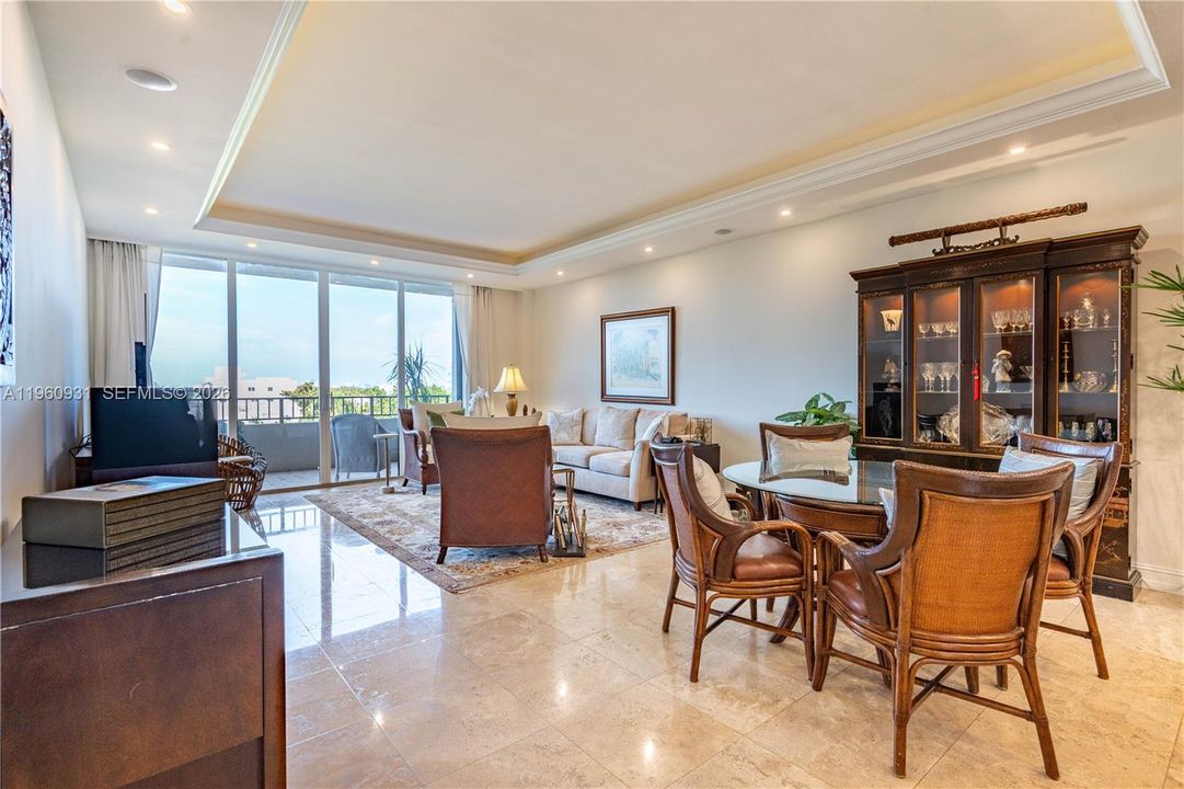 A spacious, open-plan great room features a light cone that encircles the living and dining room area.