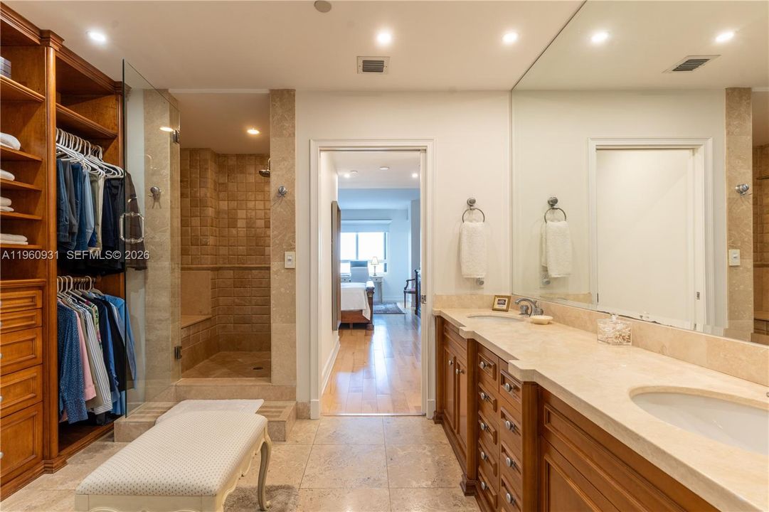 Incorporate a dual sink and a custom-made cabinet with a natural stone countertop.