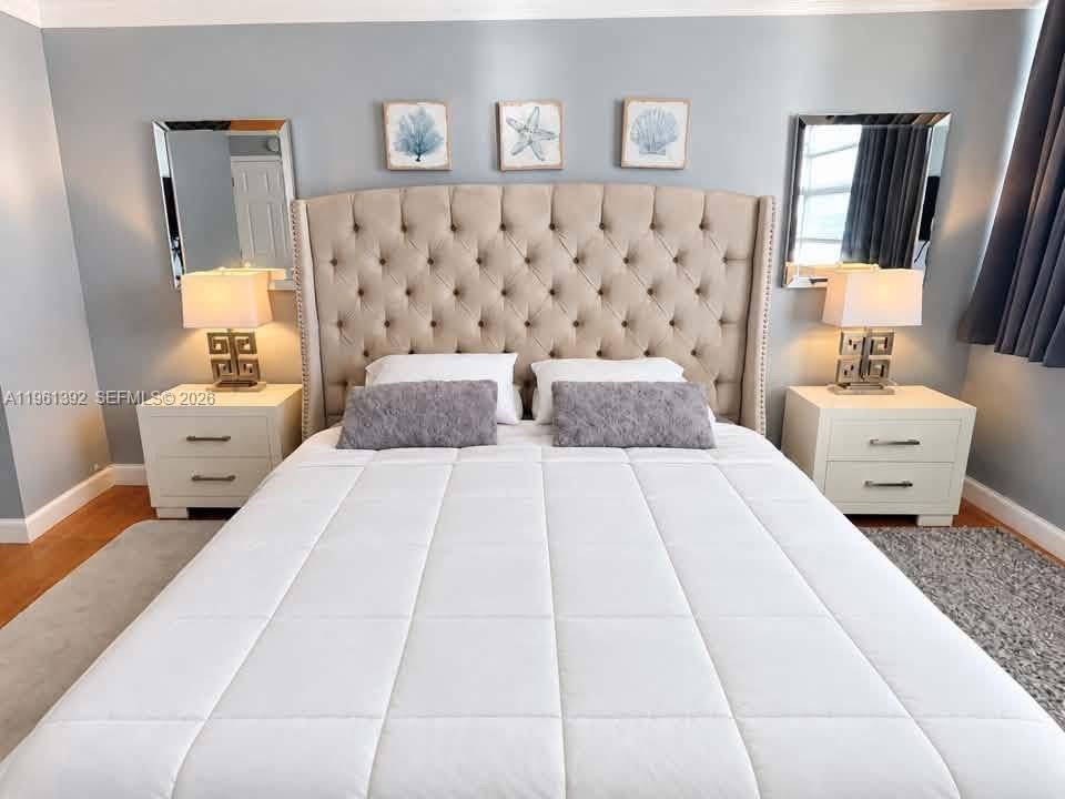 Wall-mounted rectangular mirrors and wood-finish flooring