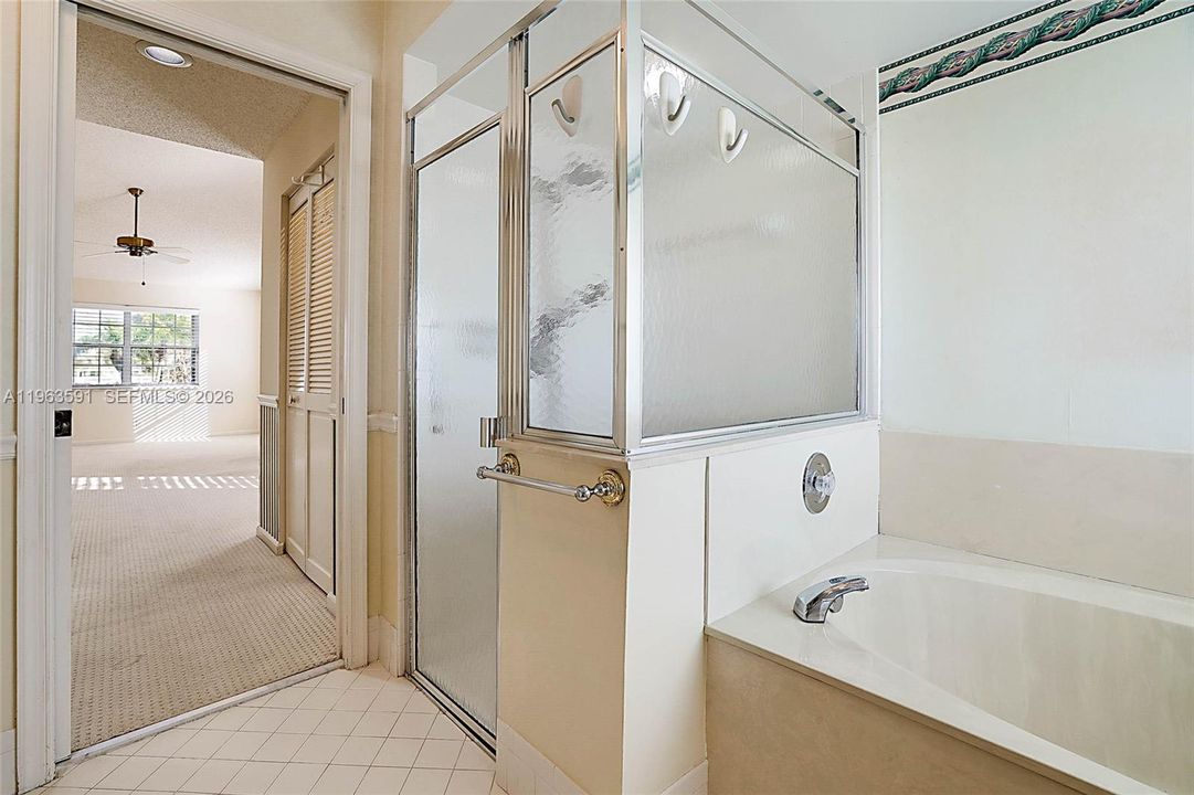 Large sunny Bathroom, roman tub, separate shower 2 sinks