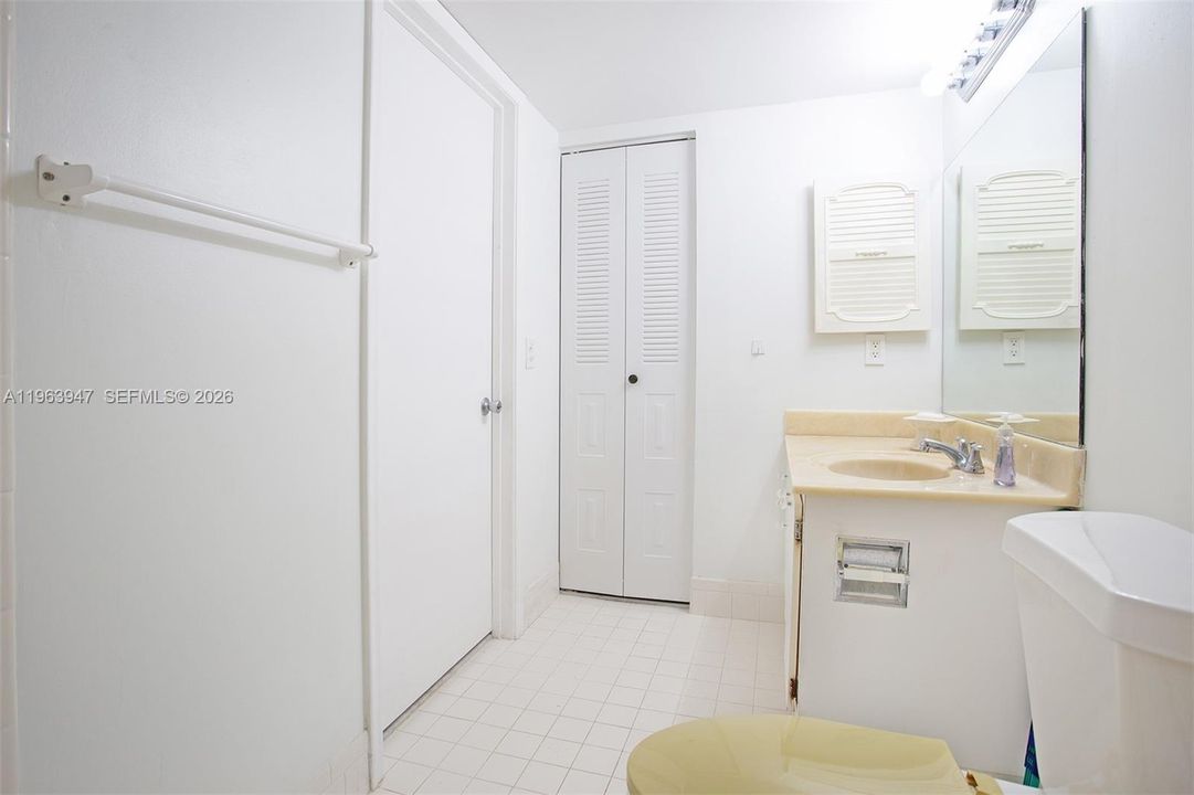 PRIMARY BATHROOM WITH VANITY AND LINEN CLOSET