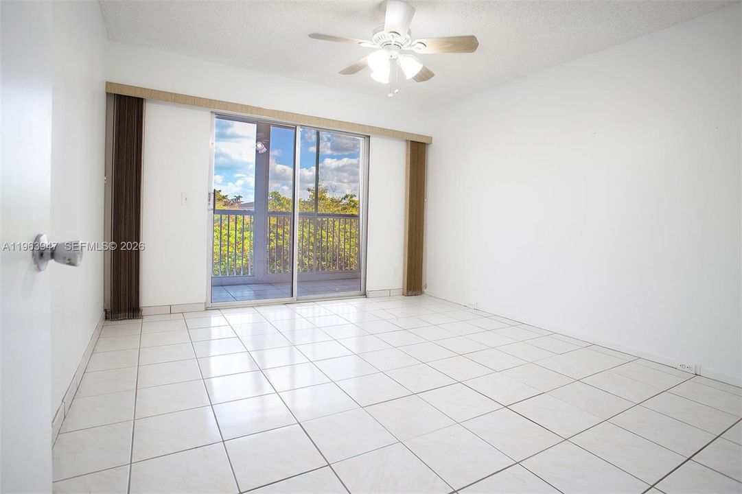 GUEST BEDROOM LEADING TO BALCONY