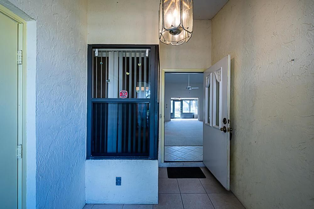 Entryway, front door, and garage door