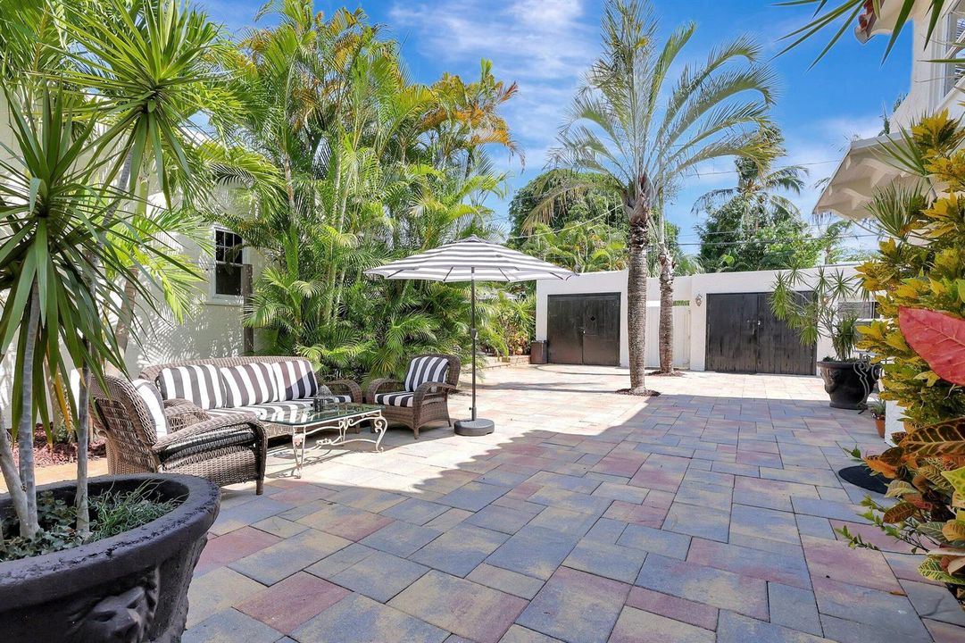 Open patio, fenced, and gated.