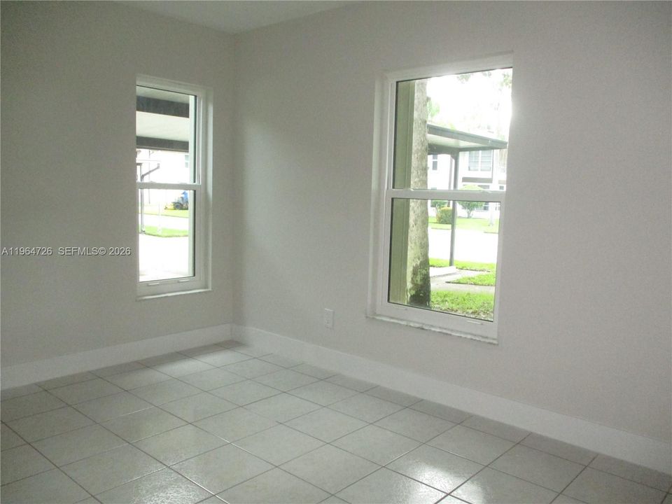 GUEST BEDROOM WITH TWO WINDOWS FOR MORNING SUN